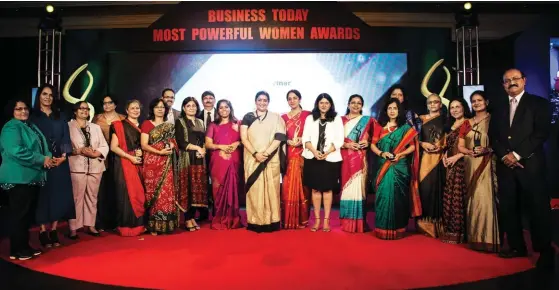  ??  ?? Most Powerful Women award winners with the Minister of Textiles, Smriti Zubin Irani (centre), India Today’s Group Editorial Director (Publishing), Raj Chengappa, and Business Today’s Editor, Prosenjit Datta