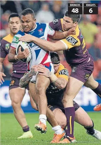  ?? Photo: Getty Images ?? Another stampede: The Knights’ Travis Waddell tries to break through the Broncos defensive line last night. His side were demolished 48-6 by the Broncos in Brisbane. Daniel Vidot, Matt Gillett, Jack Reed (twice), Lachlan Maranta, Ben Barba (three...