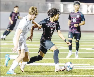  ?? Photograph courtesy of Krystal Elmore ?? Diego Palacios of Siloam Springs moves the ball against Bentonvill­e West in a match played Feb. 26 at Panther Stadium.