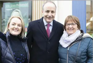  ??  ?? Cllr Lisa McDonald and FF Leader Micheál Martin on the campaign trail on Wexford’s Main Street with Kathleen Rossiter from Kennedy Park.