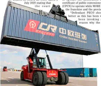  ?? XINHUA ?? A REACH stacker handles cargo containers at the Manzhouli Railway Station in Manzhouli, North China's Inner Mongolia autonomous region.