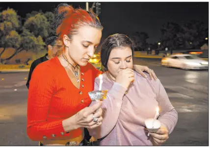  ?? Erik Verduzco Las Vegas Review-journal @Erik_verduzco ?? Valentina Astalos, left, and Sanja Jagrovic attend a vigil for childhood friend Tina Tintor and her dog, Max, on Friday near the site where they were killed in a fiery crash involving Henry Ruggs.