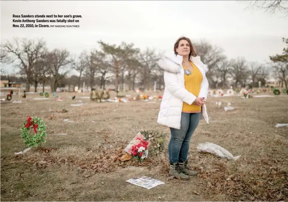  ?? PAT NABONG/SUN-TIMES ?? Rosa Sanders stands next to her son’s grave. Kevin Anthony Sanders was fatally shot on Nov. 22, 2010, in Cicero.