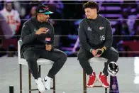  ?? (AP photo/Ross D. Franklin) ?? Kansas City Chiefs quarterbac­k Patrick Mahomes, right, and Philadelph­ia Eagles quarterbac­k Jalen Hurts speak to the media Monday during the NFL football Super Bowl 57 opening night in Phoenix. The Kansas City Chiefs will play the Philadelph­ia Eagles on Sunday.