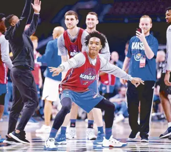  ?? REUTERS ?? Kansas Jayhawks guard Devonte’ Graham (4) shoots the ball during practice before the Final Four of the 2018 NCAA Tournament at Alamodome.