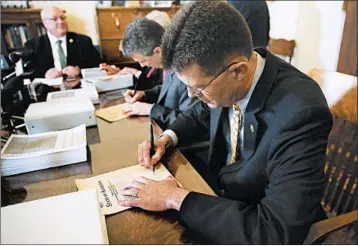  ?? BRYNN ANDERSON/AP ?? Alabama Secretary of State John Merrill certifies the results Thursday of the special election for the U.S. Senate.