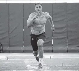  ?? TIM BROGDON/MIAMI ATHLETICS ?? Jaelan Phillips runs the 40-yard dash in an impressive 4.56 at Miami Pro Day.