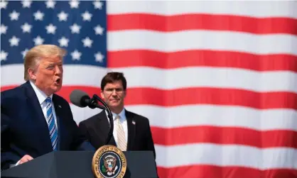  ?? Photograph: Jim Watson/AFP/Getty Images ?? Donald Trump with the defense secretary, Mark Esper, in March. A bipartisan group of senators urged Esper to ‘rescind your decision to discontinu­e support for Stars and Stripes’.