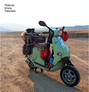  ?? Photo by Emma Trenchard ?? Above: Emma Trenchard’s Vespa, Grettle, which she travelled thousands of miles with. Right: Emma Trenchard and her dog, Molly, who she rescued in Mongolia