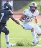  ?? / Kelly J. Huff ?? Calhoun High School’s Drew Rutledge tries to switch direction on Ridgeland High School’s Jordan Hughley during Thursday night’s football action in the Corky Kell Classic at Barron Stadium.