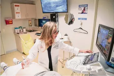  ?? Elizabeth Conley/Staff file photo ?? Dr. Irene Stafford performs an ultrasound of a pregnant patient who was diagnosed with syphilis in April at UT Physicians OBGYN clinic. A growing number of babies nationwide are being born with syphilis.