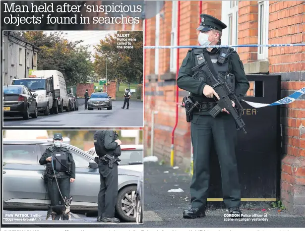  ??  ?? CORDON Police officer at scene in Lurgan yesterday