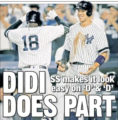  ?? Paul J. Bereswill ?? SALUTATION­S: Didi Gregorius is congratula­ted at home plate by Aaron Judge after hitting his 22nd homer of the year in the Yankees’ 8-2 pounding of the Orioles at the Stadium on Friday.