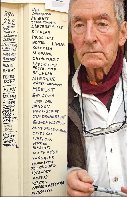  ??  ?? Aide-memoire: Raymond Briggs with the list of words and names he has written around his kitchen door