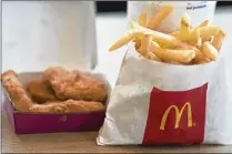  ?? CAITLIN O’HARA / BLOOMBERG ?? McDonald’s will offer a new value-priced menu next month in a bid to retain its fast-food industry lead.