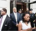  ??  ?? Bill Cosby listens to his wife Camille’s statement being read aloud by Ebonee M. Benson outside the Montgomery County Courthouse after a mistrial in his sexual assault case.