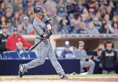  ?? AP-Orlando Ramirez, File ?? Arizona Diamondbac­ks pitcher Zack Greinke hits a three-run home run against the San Diego Padres in San Diego in 2019. While pitchers have always been viewed as the weakest link in the batting order, there was a time when they weren’t automatic outs.