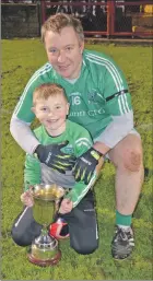  ?? (Pic: John Ahern) ?? FATHER AND SON TEAM: Dave Browne and his son, Jayden, enjoying the on field celebratio­ns following Araglin’s victory over Lismire in Páirc Uí Rinn last Saturday evening.