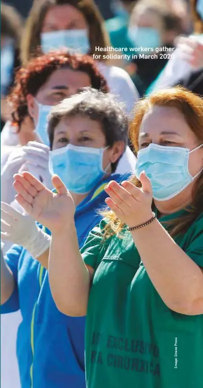  ?? ?? Healthcare workers gather for solidarity in March 2020