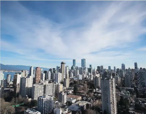  ?? DARRYL DYCK / THE CANADIAN PRESS FILES ?? Condos and apartment buildings in downtown Vancouver. The Real Estate Board of Greater Vancouver says home sales dipped in June compared with a record high set a year ago, but condo sales have risen over the same period.