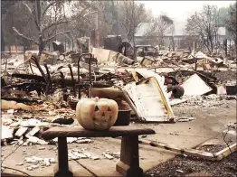  ?? Photo courtesy of Adam Lee ?? Homes burn to the ground in Coffey Park in Santa Rosa less than a mile from Siduri Winery this week.