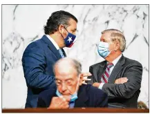  ?? ANNA MONEYMAKER/THE NEW YORK TIMES ?? Texas Republican Sen. Ted Cruz (left) confers with Senate Judiciary Committee Chairman Lindsey Graham, R-S.C., behind Sen. Chuck Grassley, R-Iowa, during the fourth day of the confirmati­on hearing for Amy Coney Barrett.