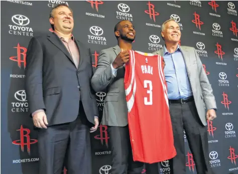  ?? Karen Warren / Houston Chronicle ?? Rockets general manager Daryl Morey, left, made one of his customary offseason splashes by trading for Chris Paul.