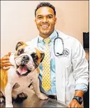  ?? South Buffalo Springs Animal Hospital ?? Dr. Aaron Bivens, a veterinari­an at South Buffalo Springs Animal Hospital, with his English bulldog, Slim.