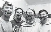  ?? MATT SAUNTER ?? Adapting quickly to the new normal, Matt Saunter, left, Matt Butschek, NaomiWorce­ster and Charlie Thomas wear masks after arriving in Honolulu following an eight-month expedition to Kure Atoll in the Northweste­rn Hawaiian Islands.