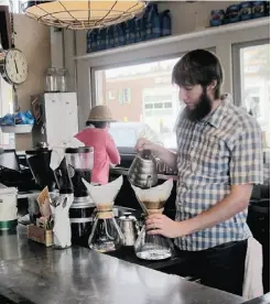  ??  ?? A barista serves up some beverages a t Oddfellows in Fort Worth.