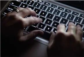  ?? CP PHOTO JONATHAN HAYWARD ?? Experts are calling for transparen­cy and oversight around how political parties mining data. A woman uses her computer keyboard to type while surfing the internet in North Vancouver, B.C., in December 2012.