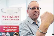  ?? JULIE JOCSAK THE ST. CATHARINES STANDARD ?? Earl Warren is photograph­ed with his MedicAlert Connect Protect bracelet at Niagara Regional Police Headquarte­rs in Niagara Falls on Tuesday.