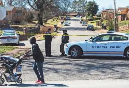  ?? BRAD VEST/THE COMMERCIAL APPEAL ?? Memphis police block traffic from entering the area near a barricaded home on the 800 block of Lucille in South Memphis.