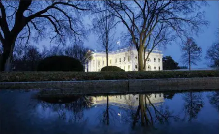  ?? ALEX BRANDON — THE ASSOCIATED PRESS ?? The North Portico of the White House is seen Friday in Washington. The partial government shutdown will almost certainly be handed off to a divided government to solve in the new year, as both parties traded blame Friday and President Donald Trump sought to raise the stakes in the weeklong impasse.