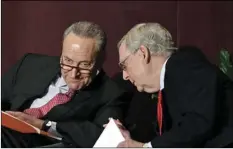  ??  ?? Senate Minority Leader Charles Schumer, D-N.Y. (left) talks with Senate Majority Leader Mitch McConnell, R-Ky., before his speech at the McConnell Center’s Distinguis­hed Speaker Series on Monday in Louisville, Ky. AP PHOTO/TIMOTHY D. EASLEY