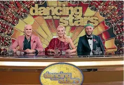 ?? ?? Lance Savali gets stuck in on Celebrity Treasure Island, left, and alongside fellow DWTS judges Camilla Sacre-Dallerup and James Luck, above.