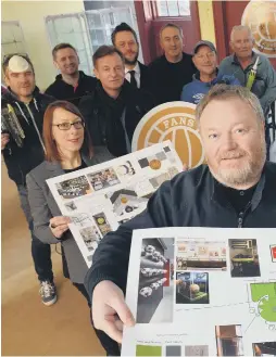  ??  ?? Michael Ganley with renovation plans of SAFC Fans Museum, below, and, right and below right, getting help from volunteers.