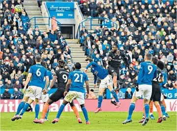  ??  ?? High and mighty: Antonio Rudiger rises above the Leicester defence to send a powerful header home for Chelsea’s equaliser