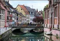  ?? Rick Steves’ Europe/CAMERON HEWITT ?? Colmar’s Germanic half-timbered houses combine with traditiona­l French shutters to make this town a picturesqu­e place to linger.