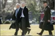  ?? ANDREW HARNIK - THE ASSOCIATED PRESS ?? President Donald Trump’s Chief of Staff John Kelly, left, and White House Director of Legislativ­e Affairs Marc Short, second from left, walk toward Marine One on the South Lawn of the White House in Washington, Jan. 5, to travel with President Donald...