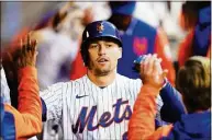  ?? Frank Franklin II / Associated Press ?? New York Mets’ Brandon Nimmo celebrates with teammates after hitting a home run during the fourth inning against the Washington Nationals Oct. 4 in New York.