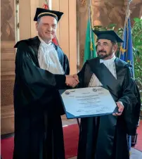  ?? Wam ?? Sheikh Sultan receives the honorary doctorate certificat­e from Professor Guido Saracco in Italy. —