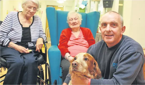  ??  ?? A GOOD BOY: David Stafford with William, who is a beloved resident of the Lochaber care home; now the pair are responsibl­e for saving a woman from hypothermi­a