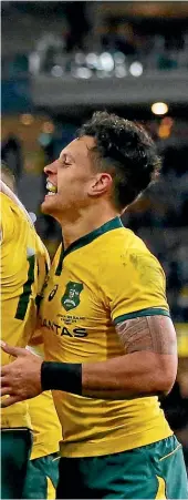  ?? GETTY IMAGES ?? Australian wing Reece Hodge makes his delight obvious after scoring one of his two tries in the Wallabies’ crushing win in Perth. Ngani Laumape, No 22, can only watch the celebratio­ns.