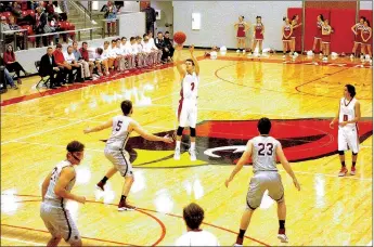  ?? PHOTOS BY MARK HUMPHREY ENTERPRISE-LEADER ?? Farmington senior Matt Wilson unleashed this deep 3-pointer from well beyond the arc before Siloam Springs’ defenders were even thinking about guarding him. Nine seconds into a Jan. 3 game at Cardinal Arena, Wilson had the first three of his...