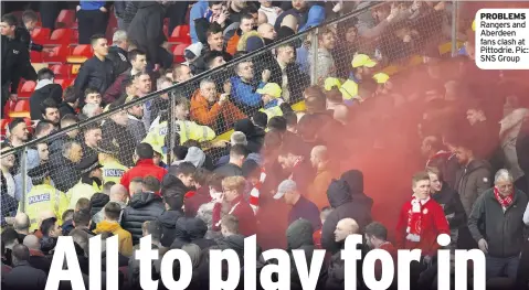  ??  ?? PROBLEMS Rangers and Aberdeen fans clash at Pittodrie. Pic: SNS Group