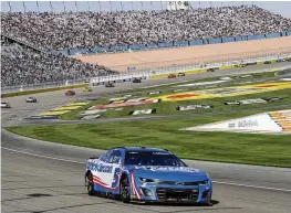  ?? IAN MAULE / AP ?? Kyle Larson (5) drives through a turn during a NASCAR Cup Series auto race at Las Vegas Motor Speedway, in Las Vegas, on Sunday.