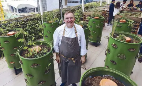  ?? Photos by WALTER BOLLOZOS ?? Greens and the city: Chef Chele Gonzalez in his Greenhouse at Gallery by Chele, an organic garden he started on the open deck behind his restaurant on the fifth floor of the Clipp Center, BGC.