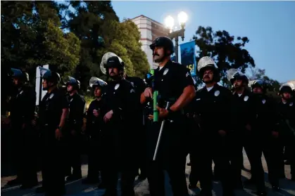  ?? Photograph: Étienne Laurent/AFP/Getty Images ?? Police officers in riot gear on campus at UCLA last week.