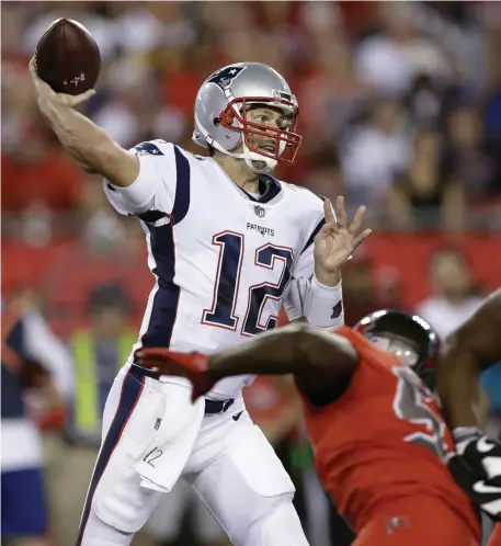  ?? AP FILE ?? TAKING HIS TALENTS SOUTH? Patriots quarterbac­k Tom Brady throws a pass against the Tampa Bay Buccaneers during a game in October 2017.